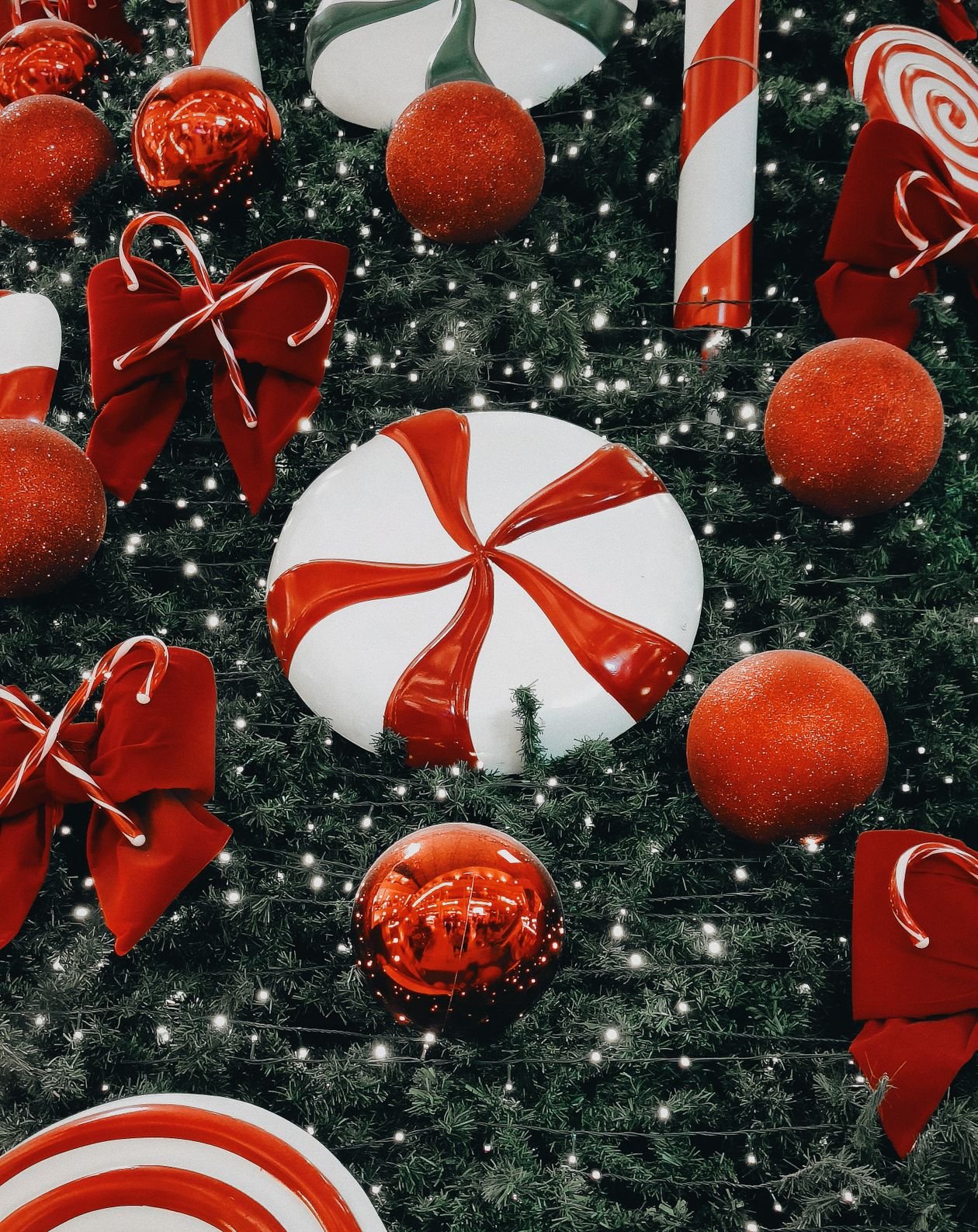 Christmas tree with red and white ornaments and candy canes