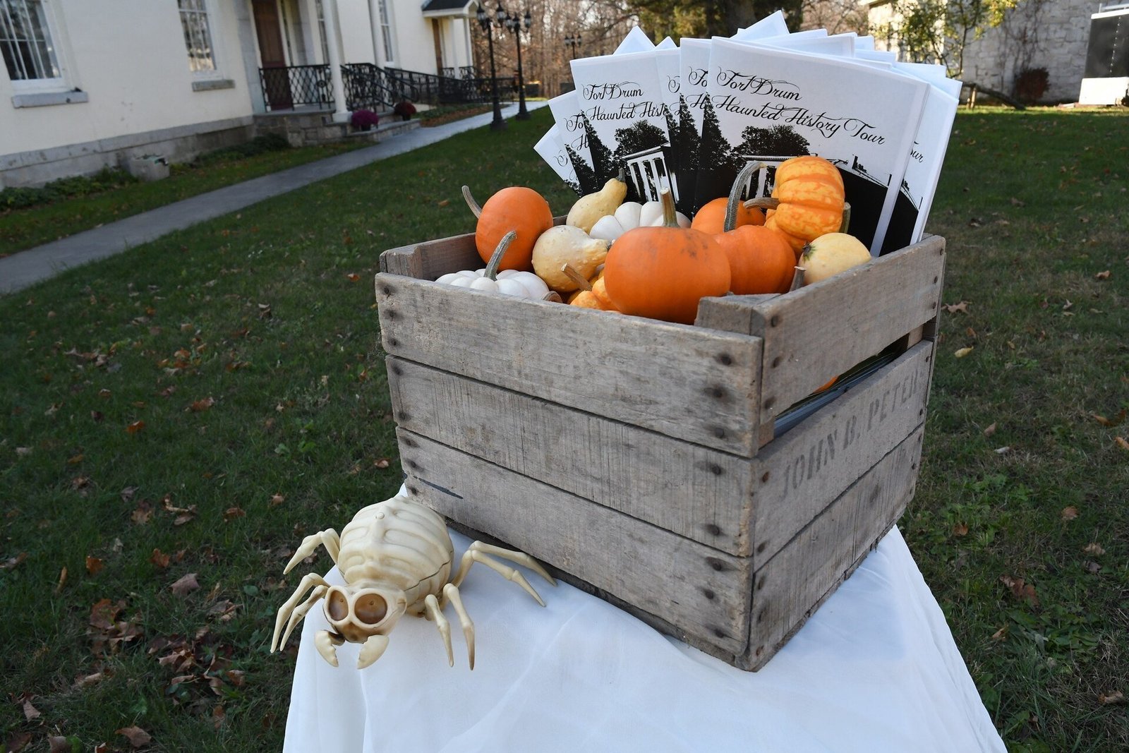 DIY tomato cage ghost ideas featuring a giant six-foot glowing ghost as a yard centerpiece