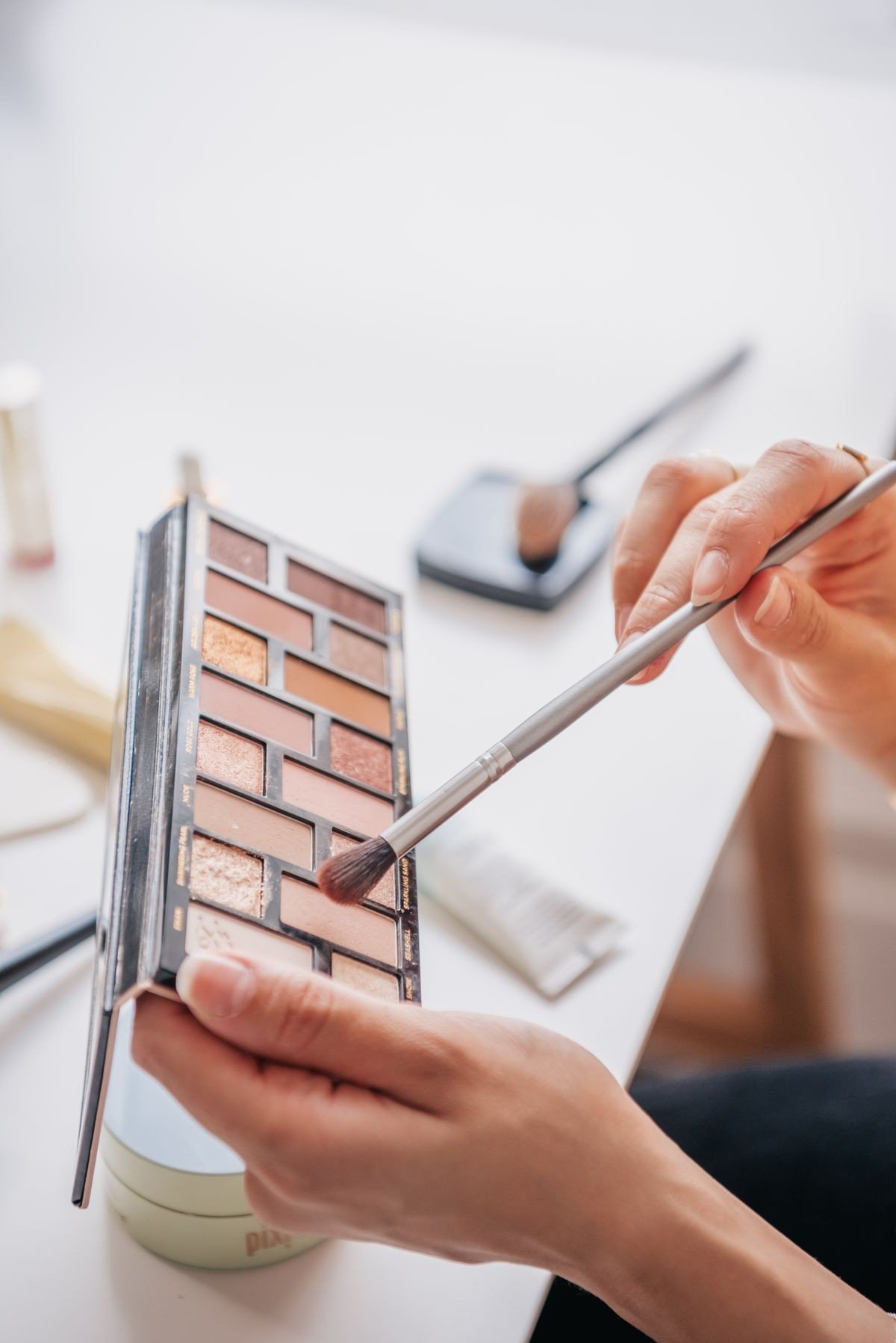 Affordable mauve blush products on a makeup table