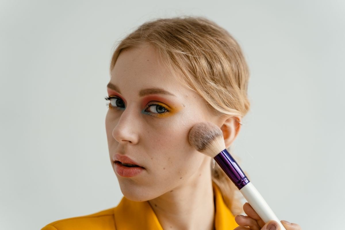 Deep berry blush shade on medium skin tone