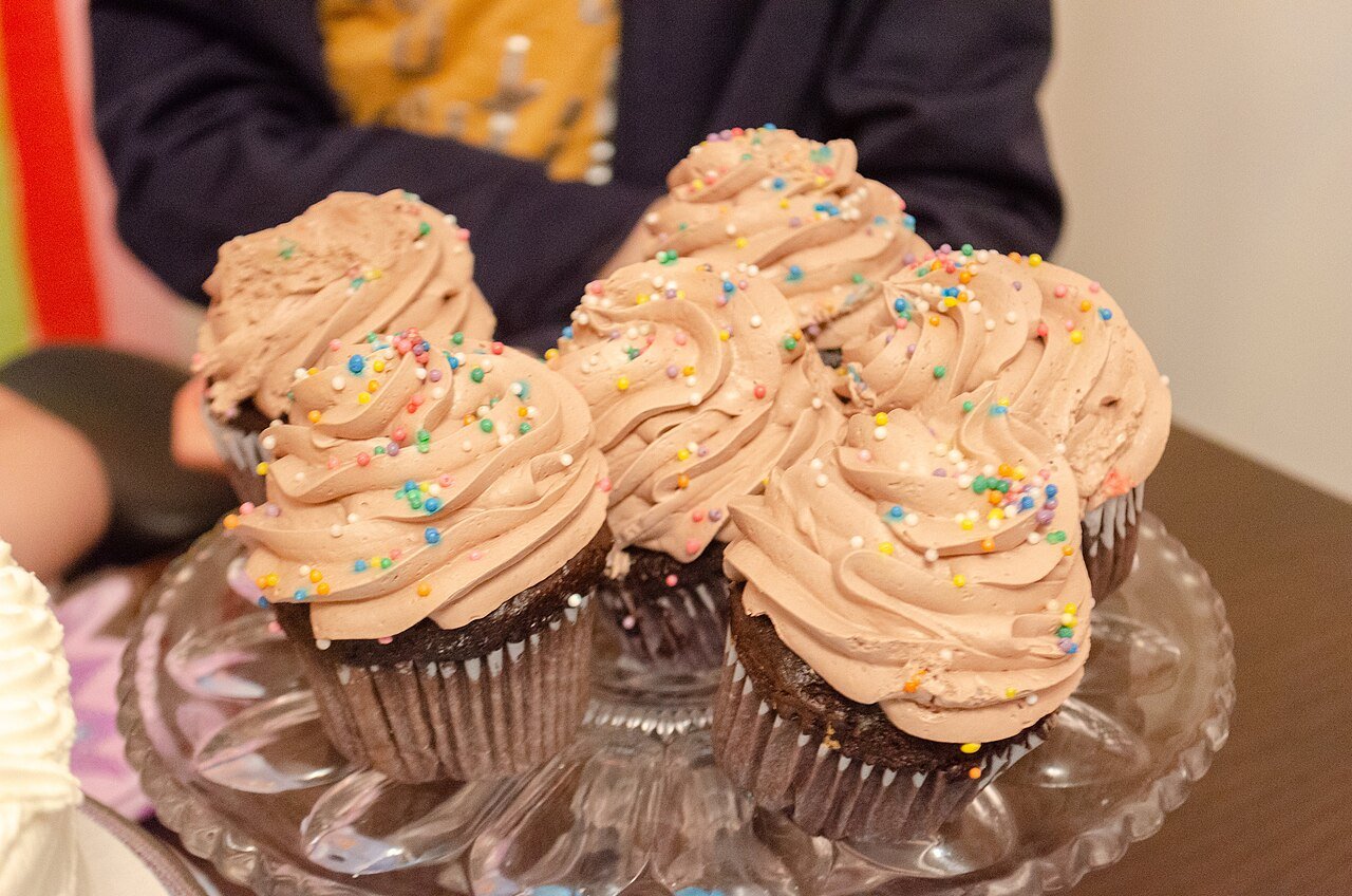 Turkey cupcakes decorated with pretzel and cookie feather alternatives