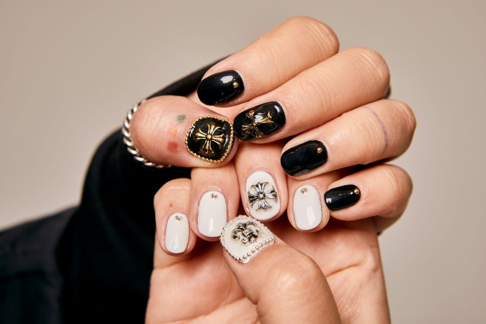 Applying top coat to protect dragonfly nail art