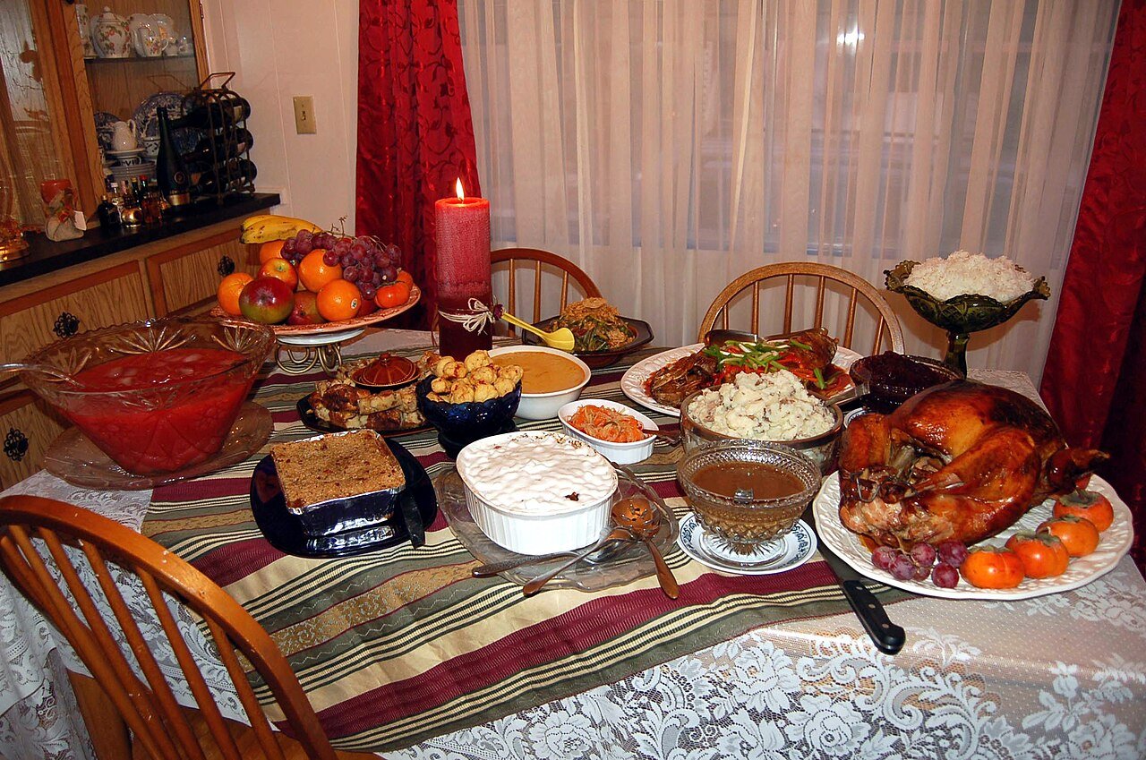 Ingredients for Thanksgiving punch including cranberry juice, apple cider and sparkling water