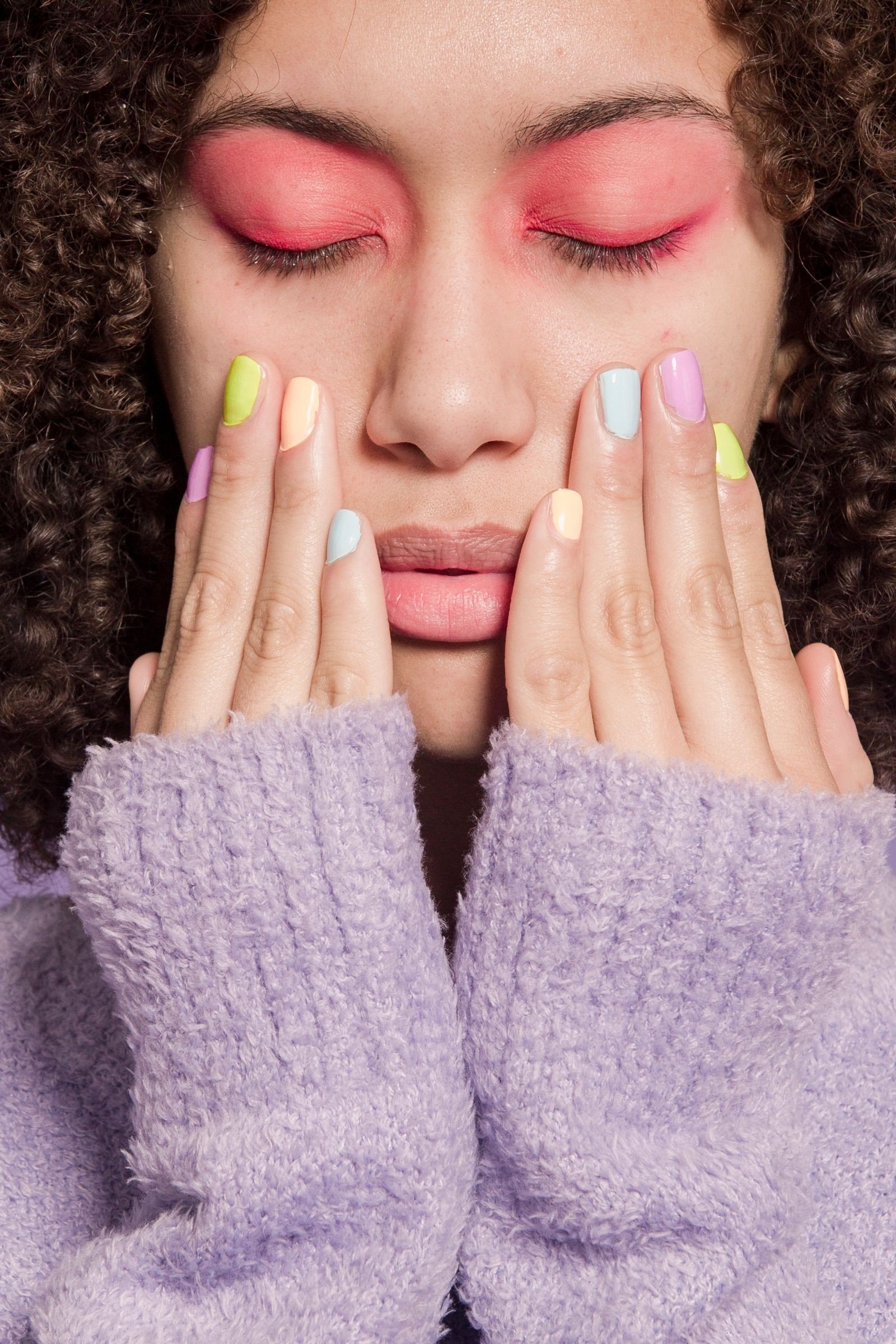 Red nails on one hand pink nails on the other