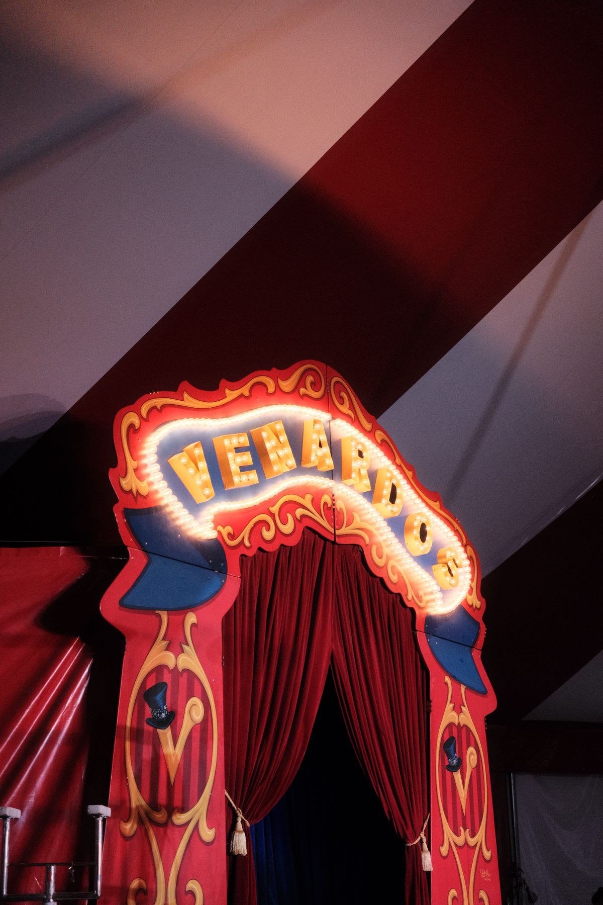 Vintage marquee lights and Edison bulb strings in circus themed decor