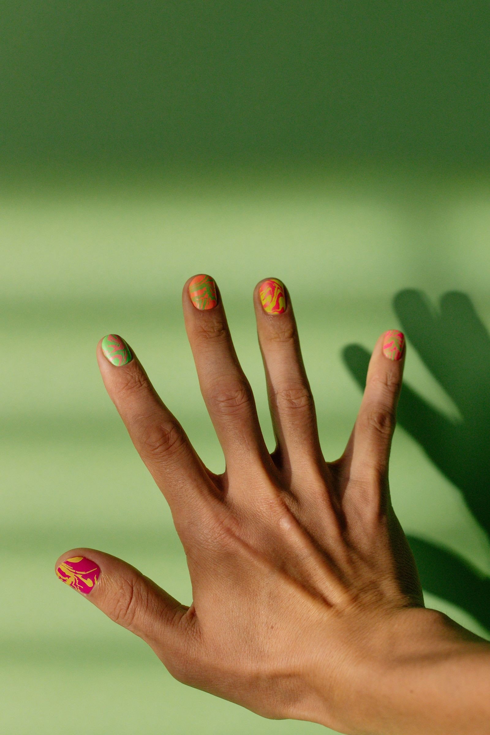 Black nails on one hand white nails on the other