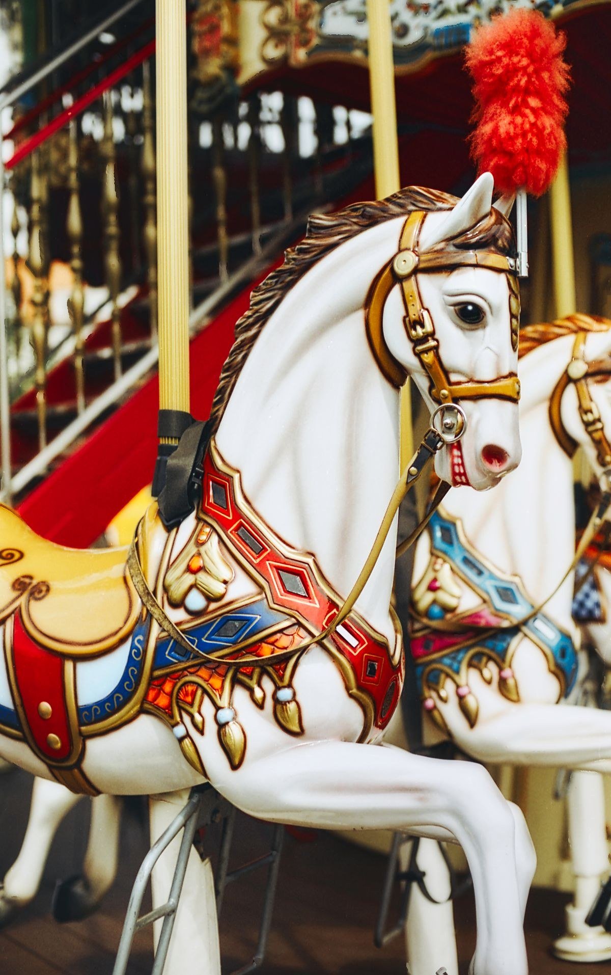 Vintage carnival games including ring toss and strongman props at party