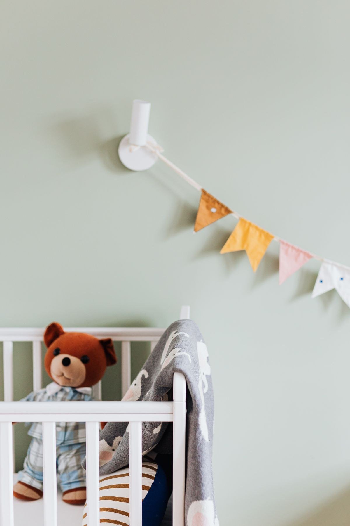 Circus nursery with striped rug star decals and patterned textiles