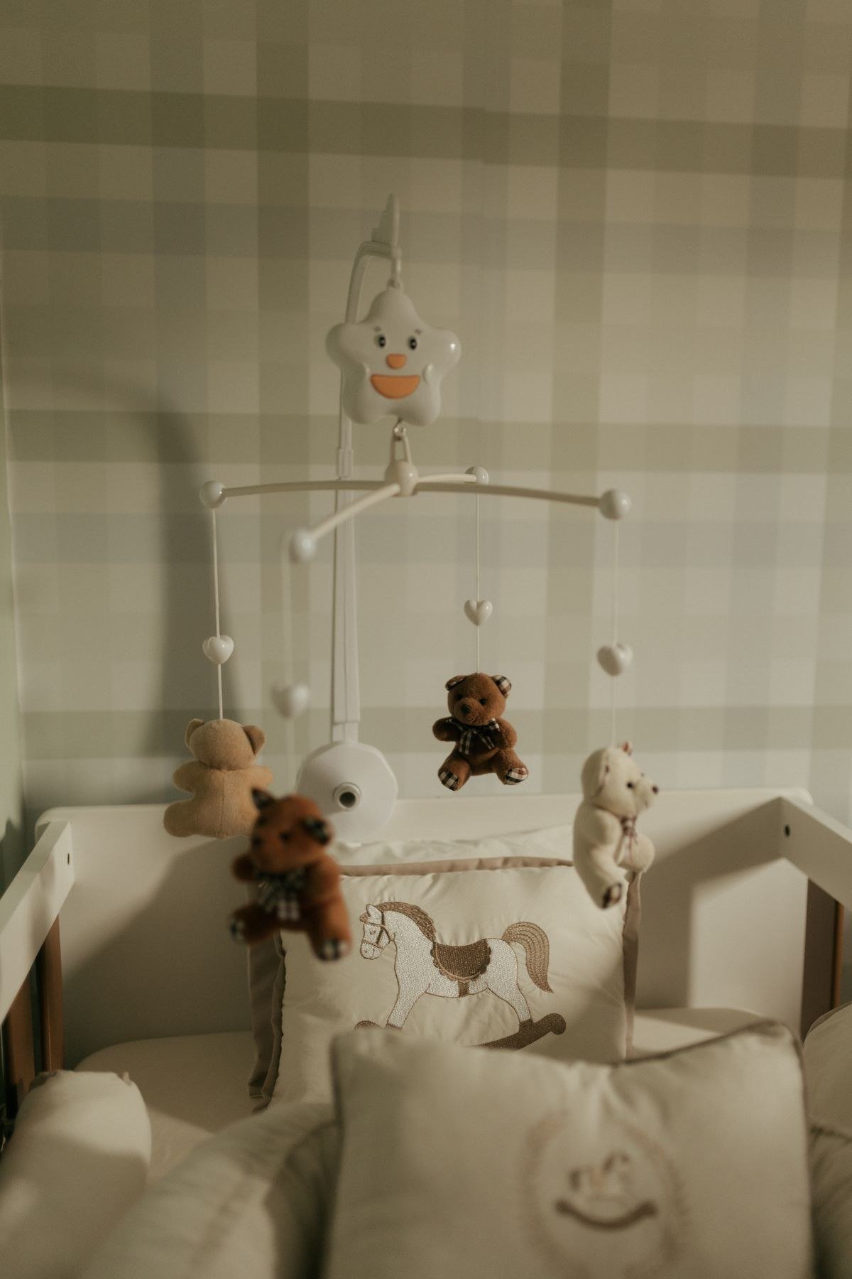 Cozy glider chair reading corner in circus nursery with lamp