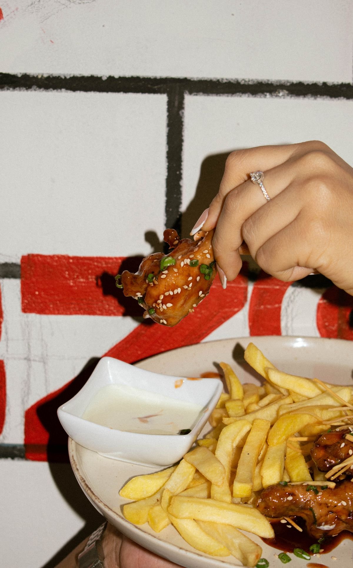 Crispy chicken wings with sauce for buffalo loaded potatoes