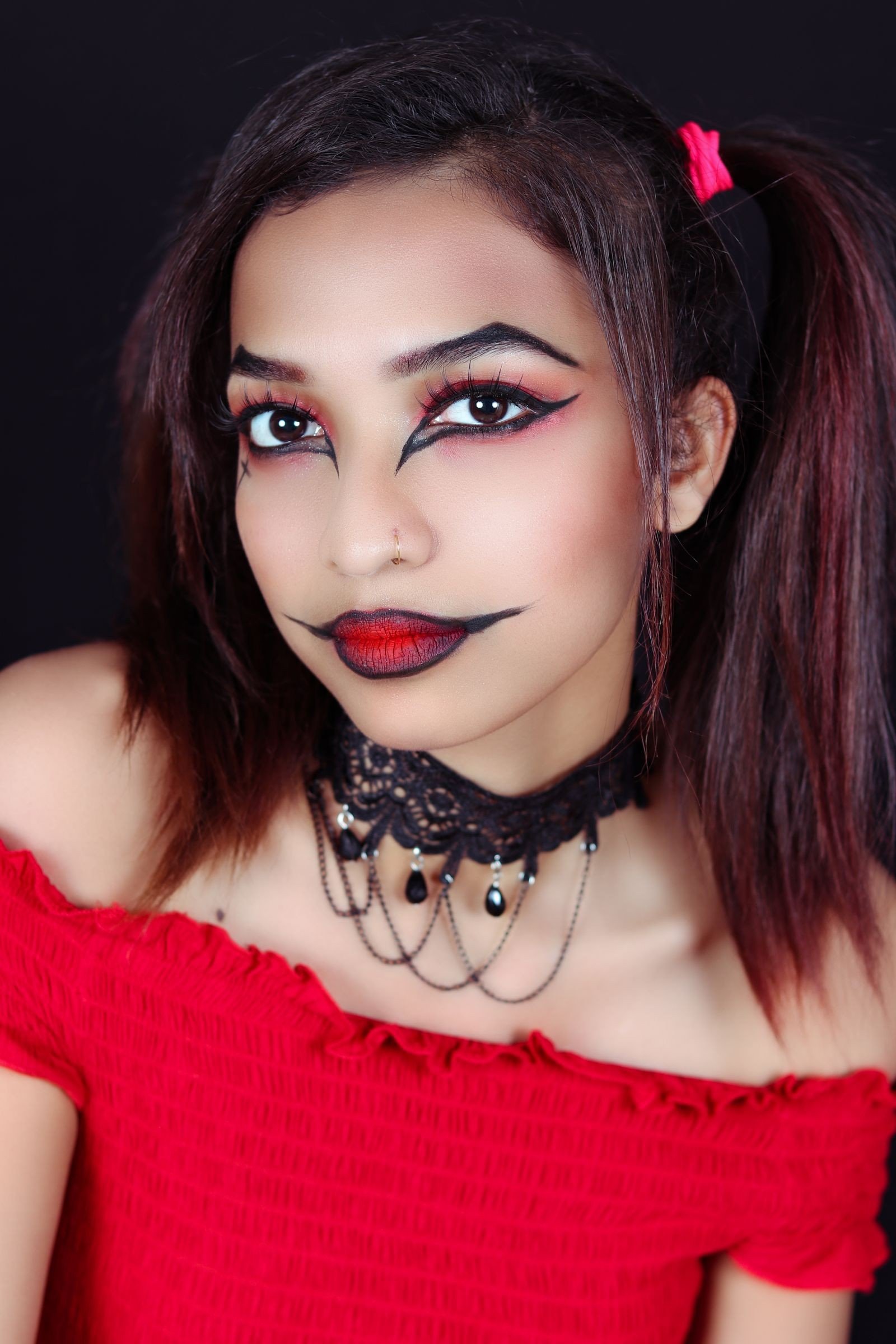 Balanced dark romantic makeup with soft features