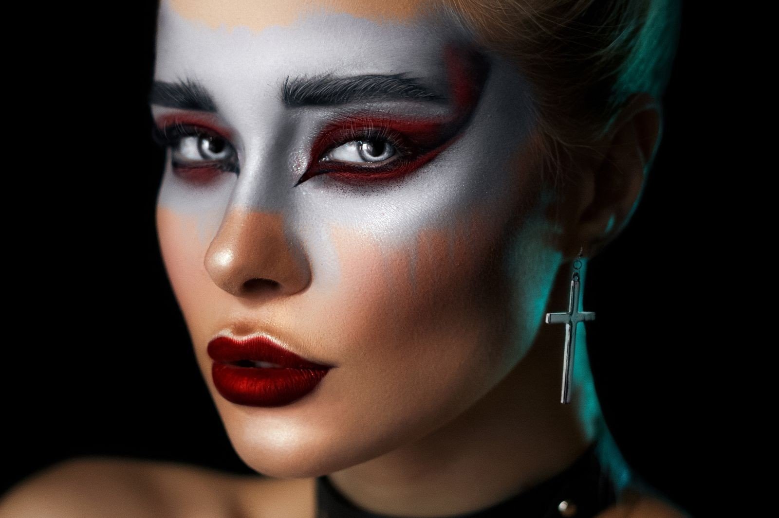 Dark romantic makeup essentials laid out on a table