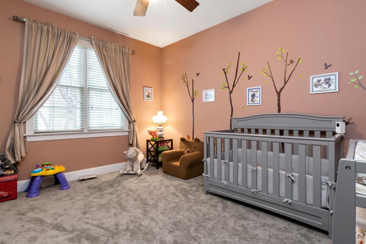Circus nursery designed for twins with two cribs and matching decor
