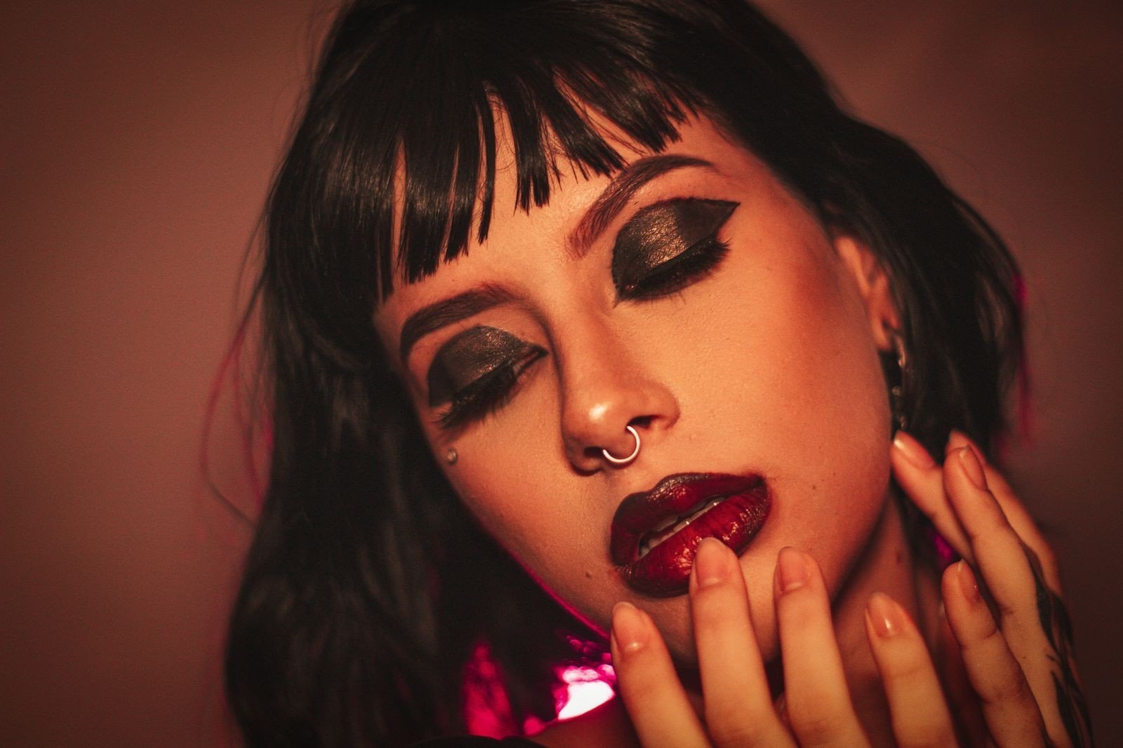 Finished dark romantic makeup look in soft light