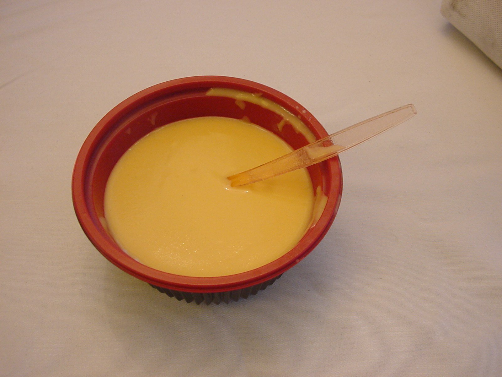 Beautifully garnished bowl of pumpkin curry soup with toppings