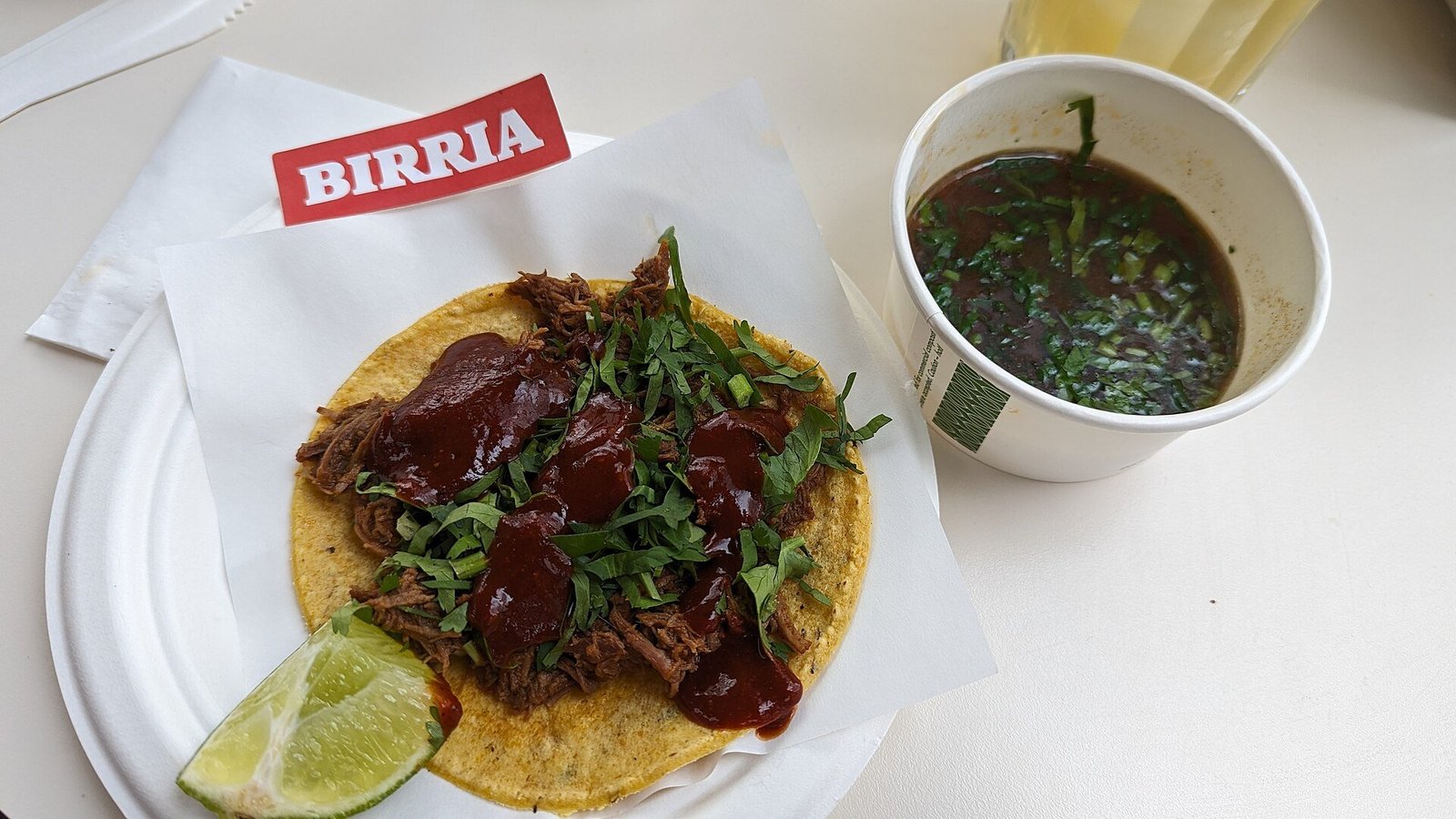Birria tacos recipe toasting dried chiles in a skillet before rehydrating
