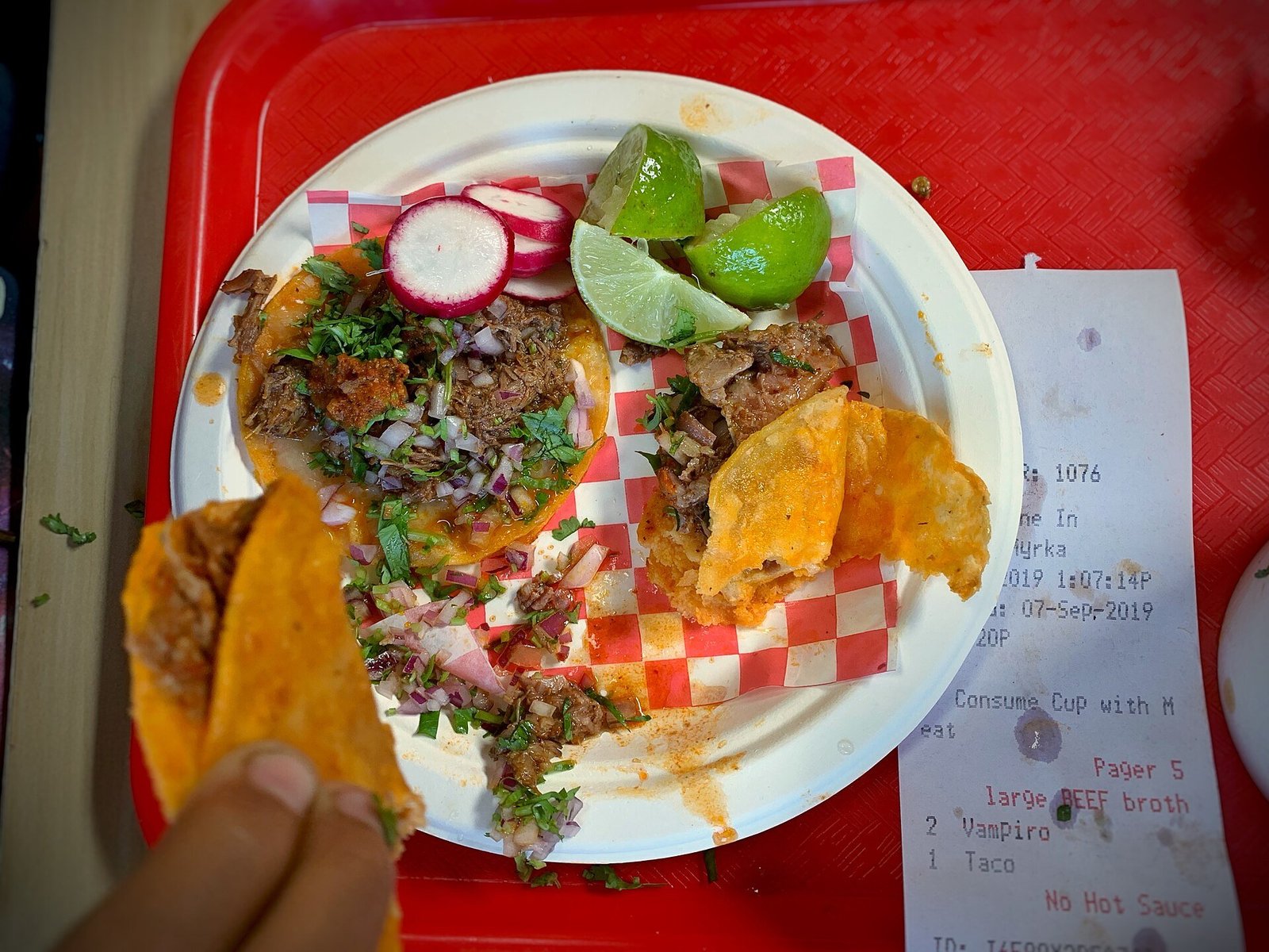 Birria tacos recipe with beef braising low and slow in chile broth