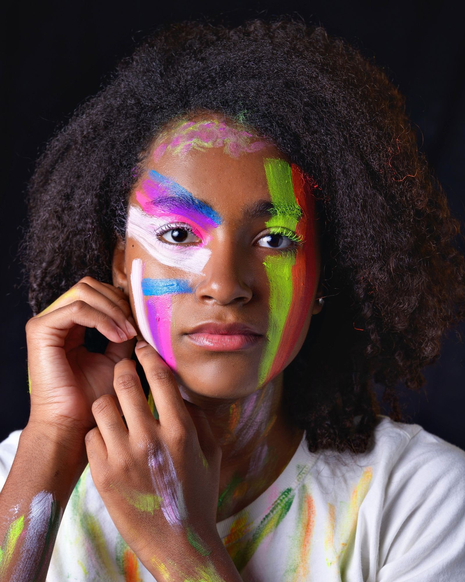 Setting spray finishing an eccentric makeup look