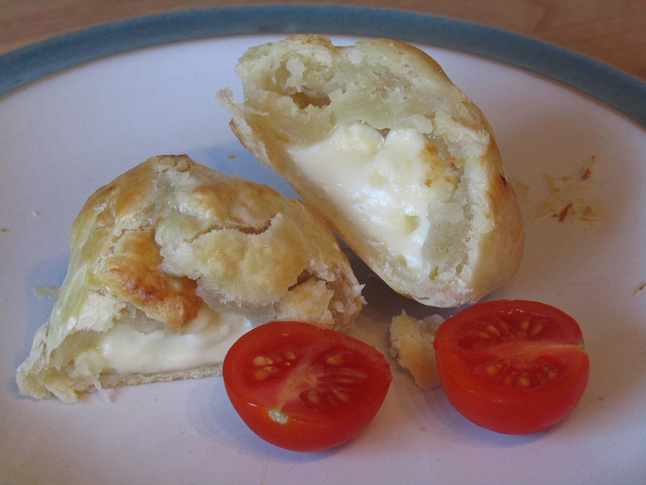 A brie and puff pastry pocket, golden and flaky