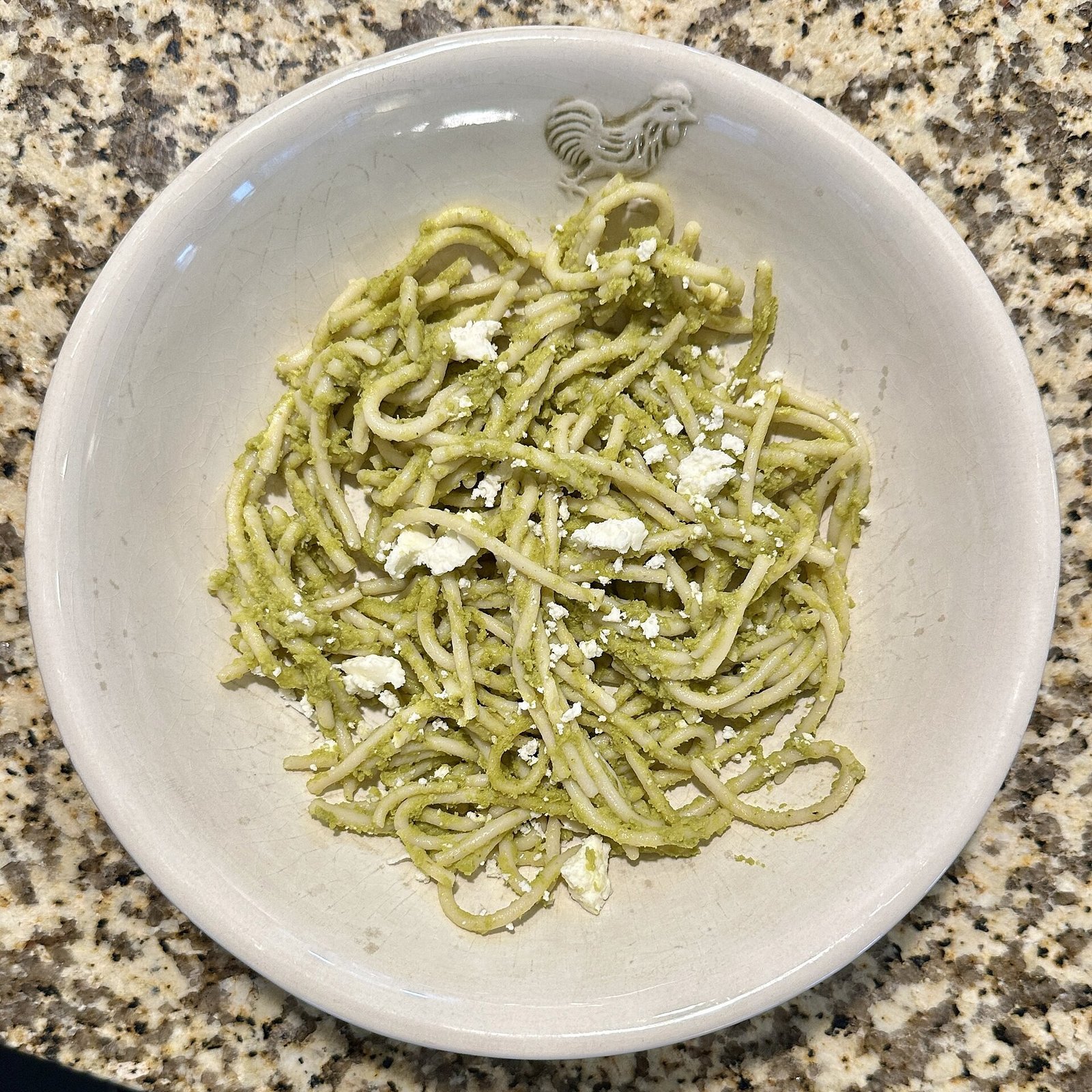 poblano and cilantro green spaghetti with queso fresco garnish