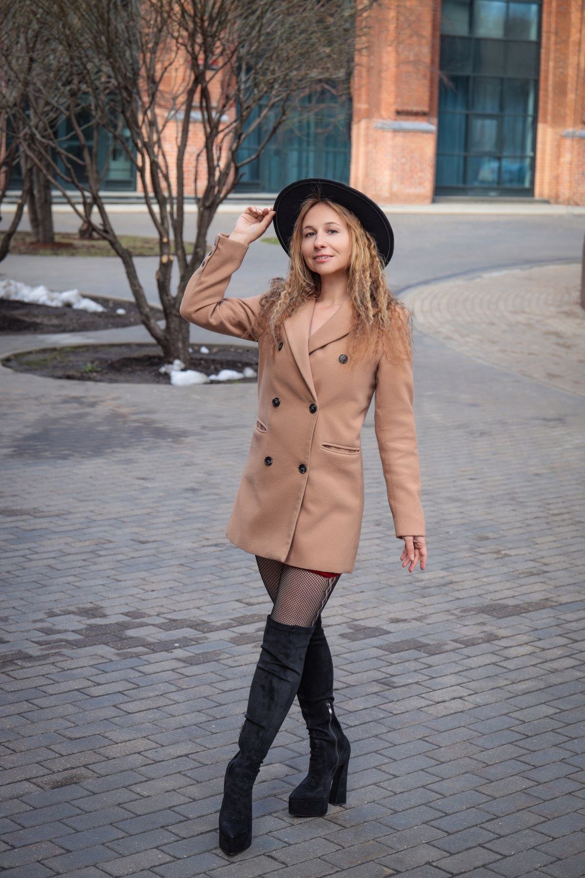 Scarf coat styled casually with white trainers