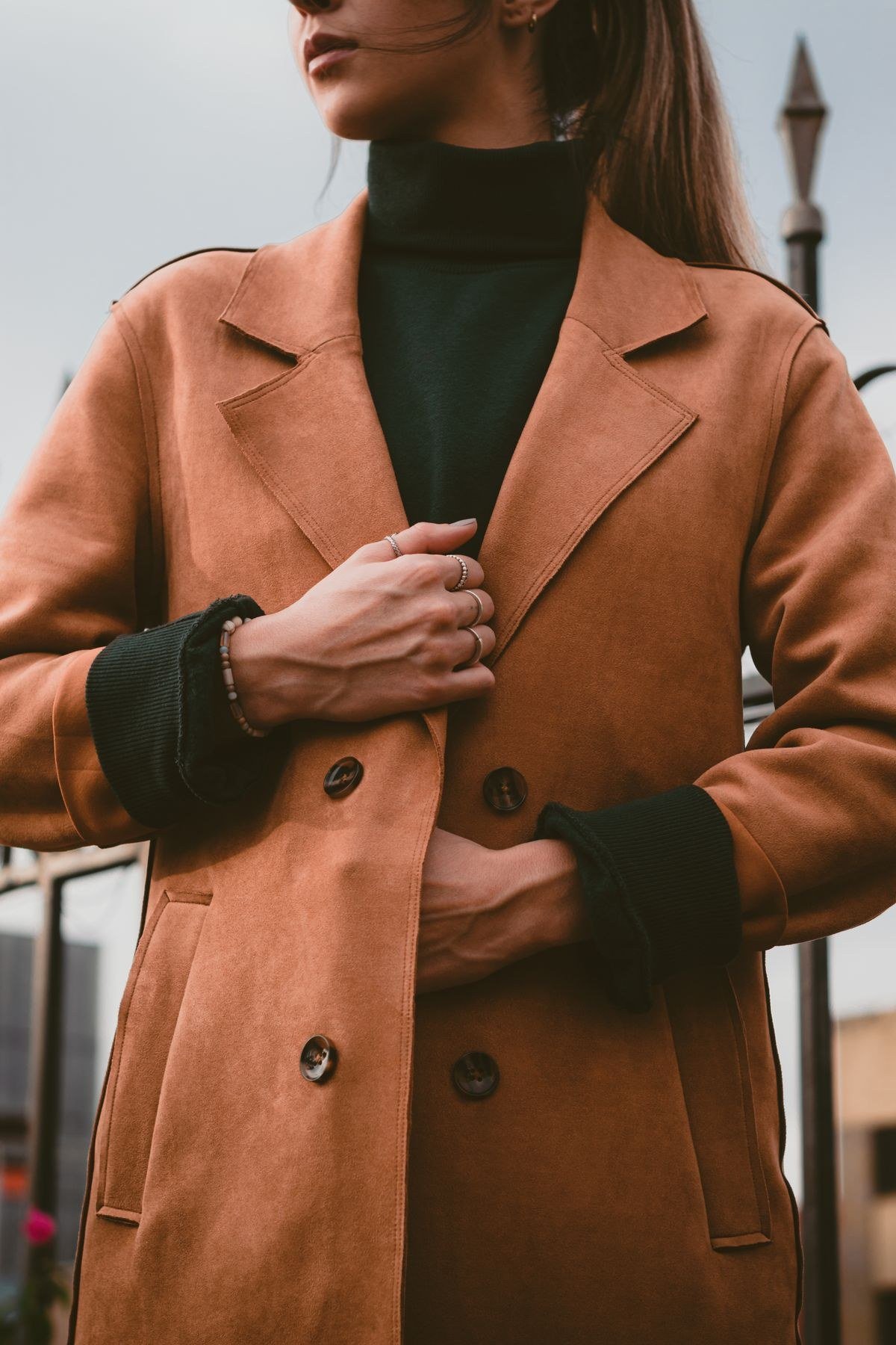 Scarf coat worn over an evening cocktail dress