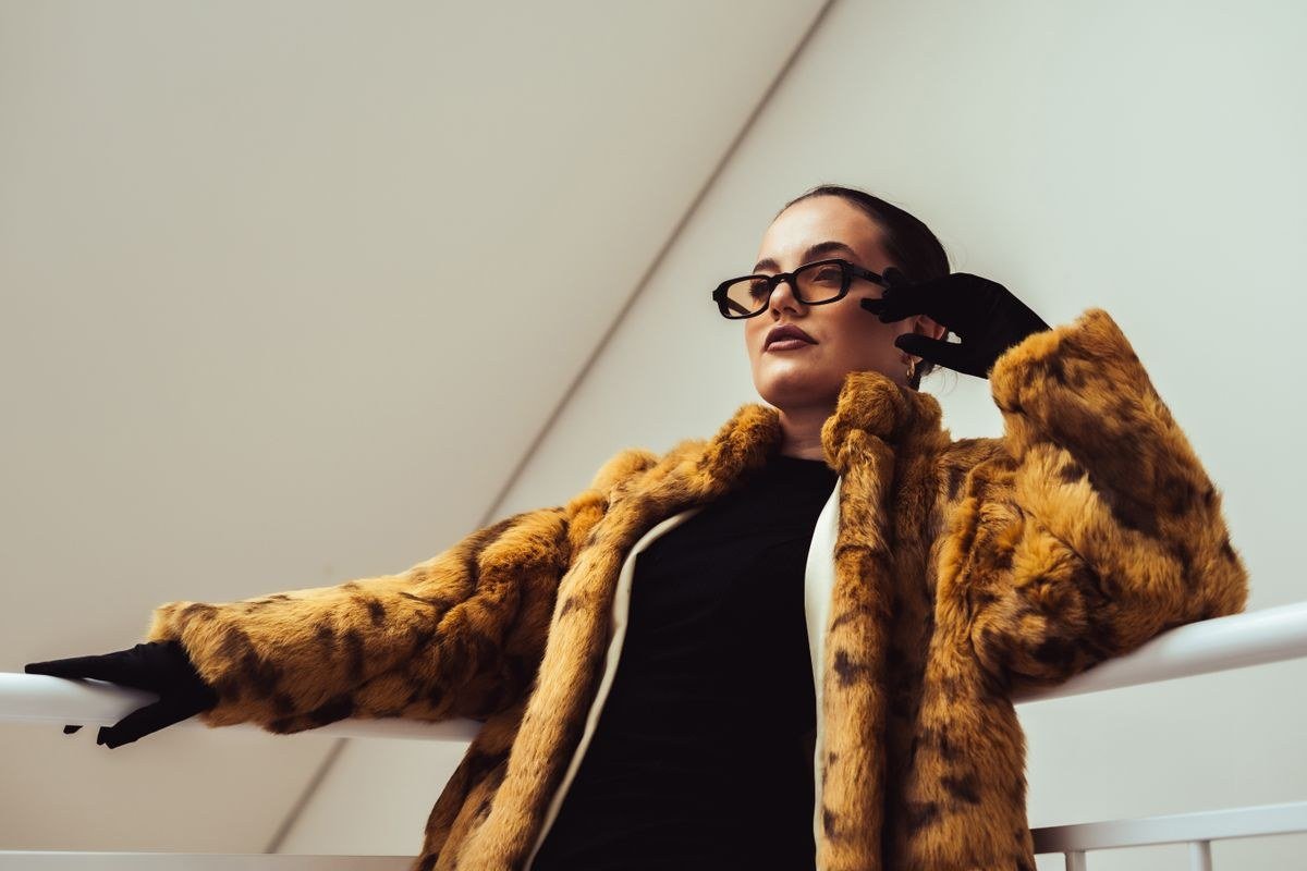 Cropped shearling jacket with high waisted trousers