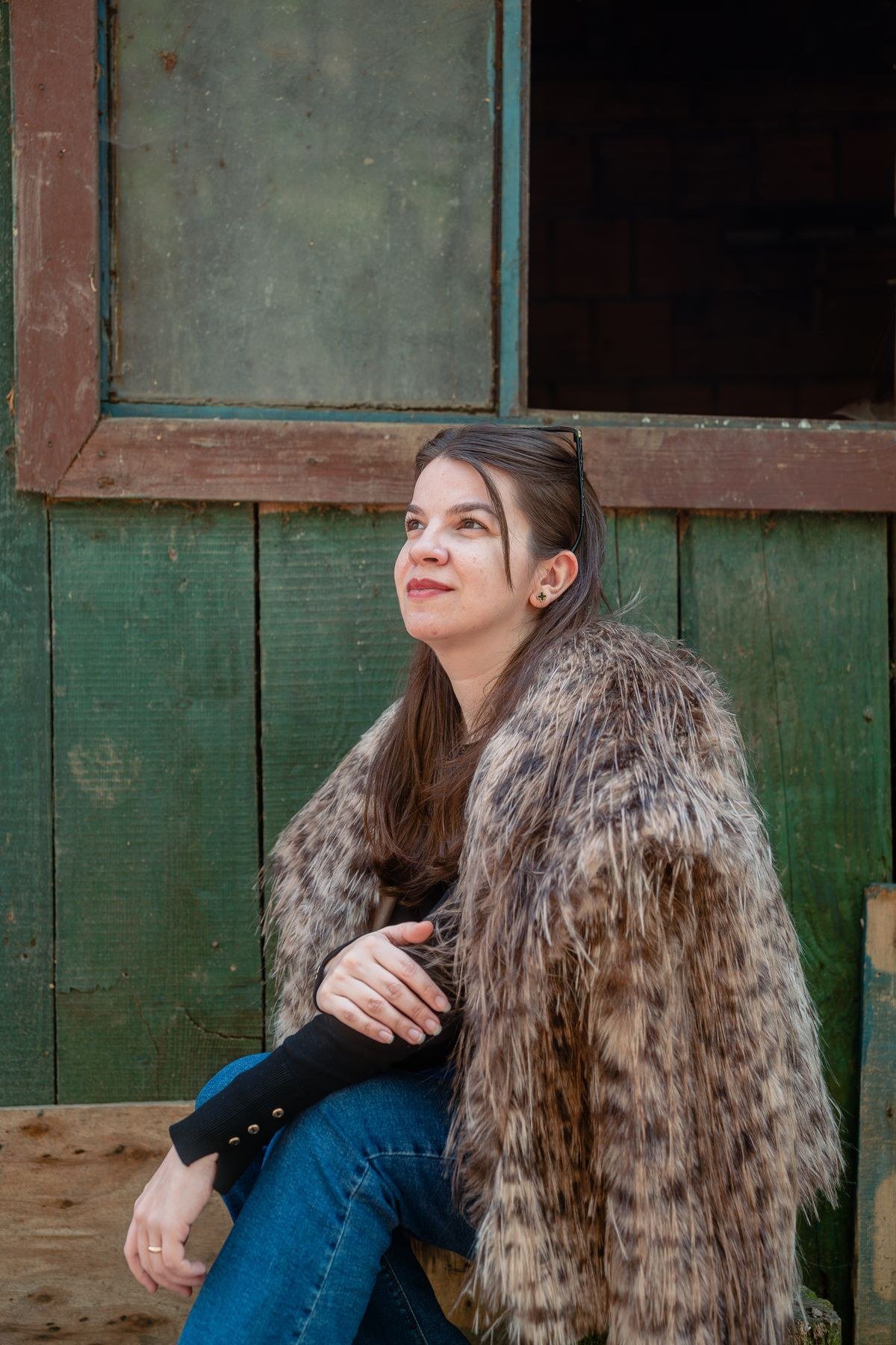 Longline shearling coat over a knit dress