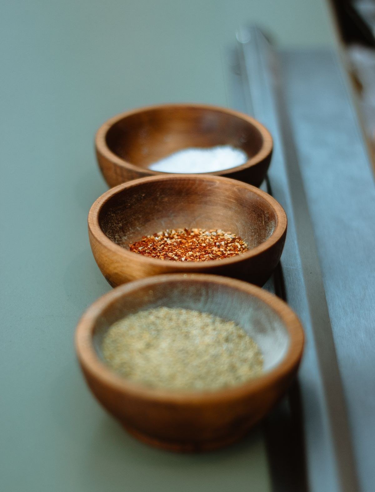 Whole spices toasting in a dry skillet on the stovetop