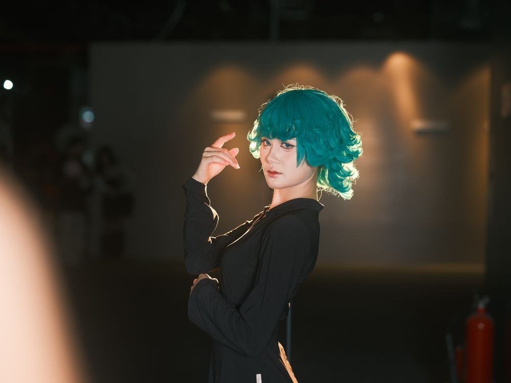 Galaxy-inspired hair with teal, pink and purple swirls