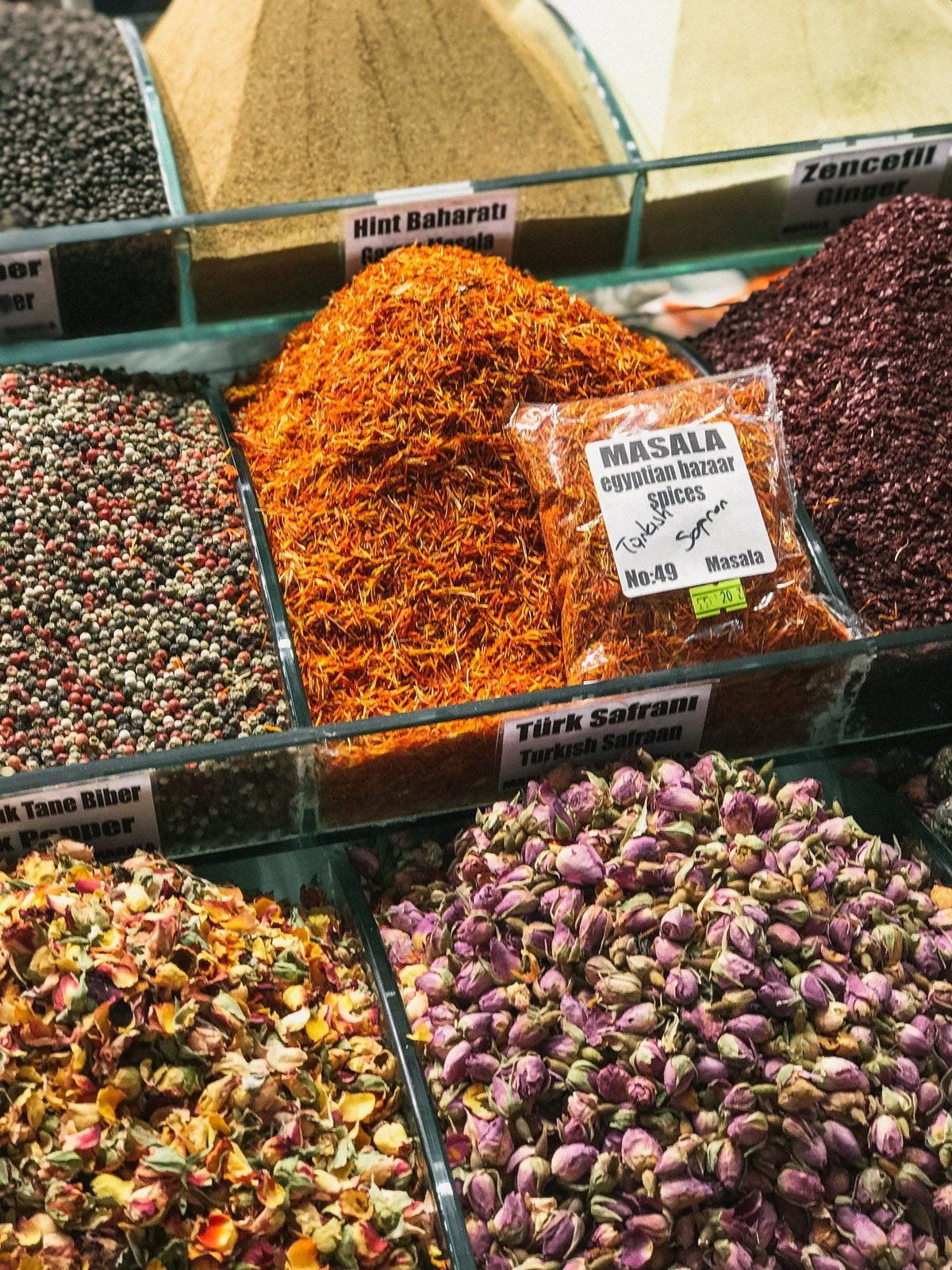 Ras el hanout spice blend with colorful ground spices in small bowls