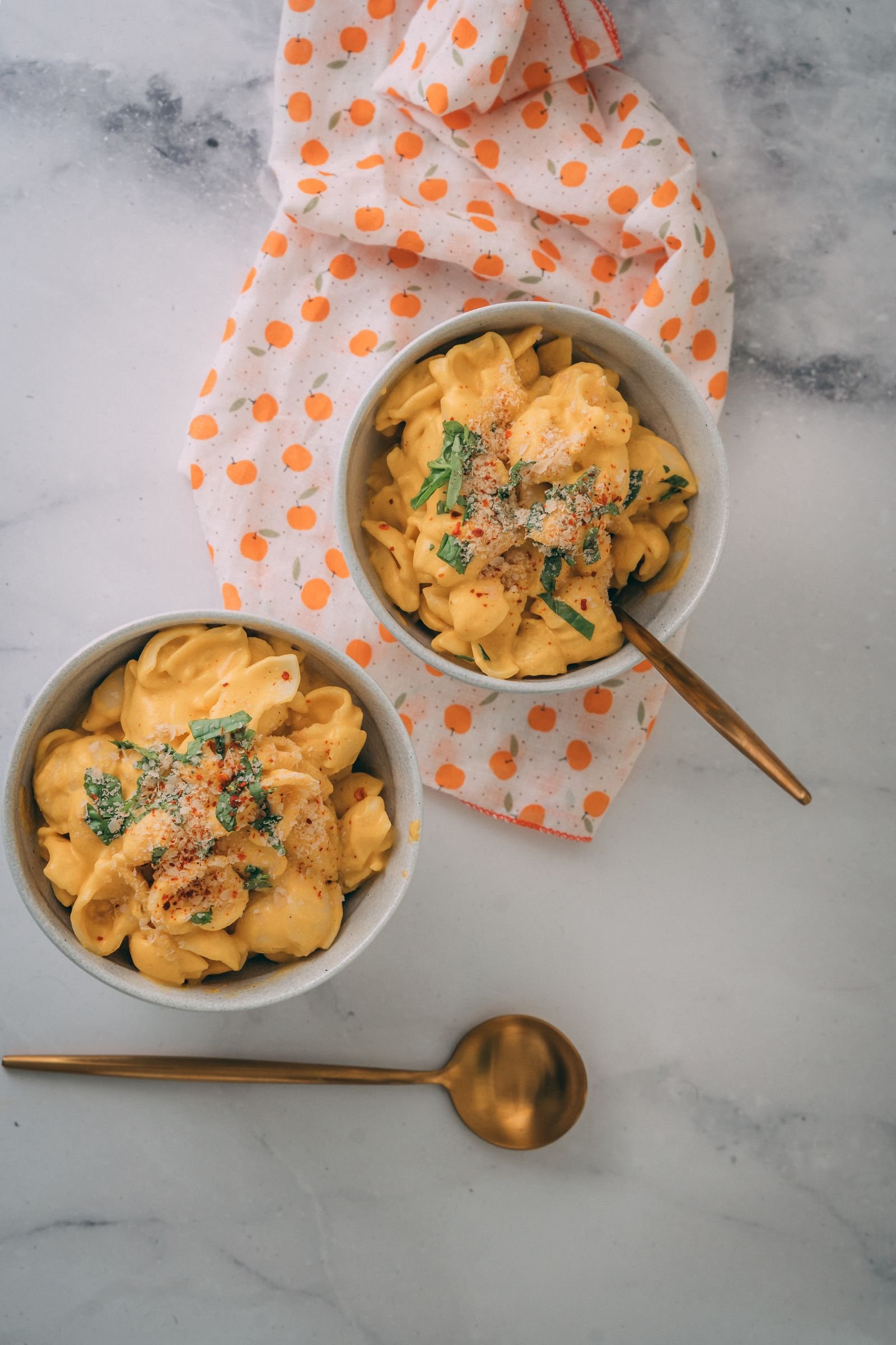 Vegan mac and cheese plated beautifully with an elegant garnish