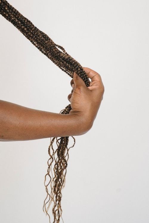 Small knotless braids mixing black and pink throughout