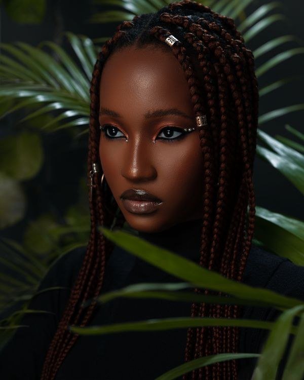 Medium knotless braids with bold pink streak sections