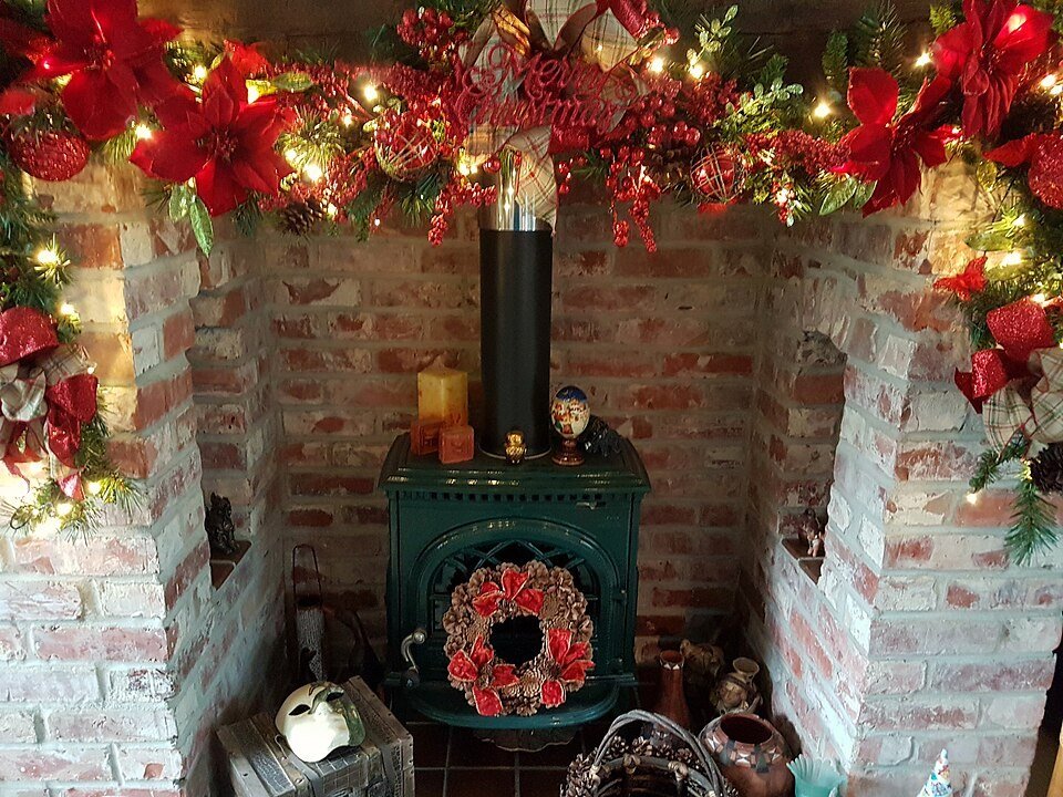 Misting a fresh garland with water to keep it fresh