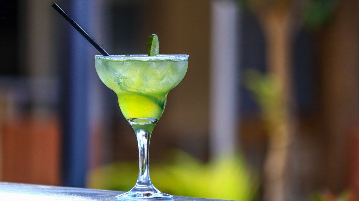Frozen black margaritas blended with ice in margarita glasses