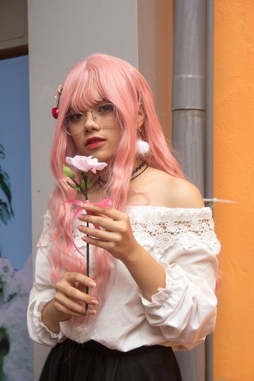 Bubblegum pink wig styled in a high ponytail
