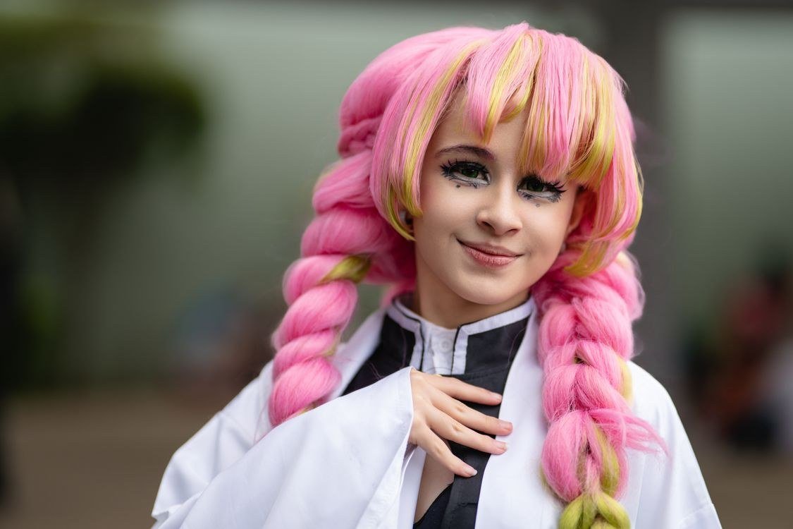 Affordable pink synthetic wig in a wavy style