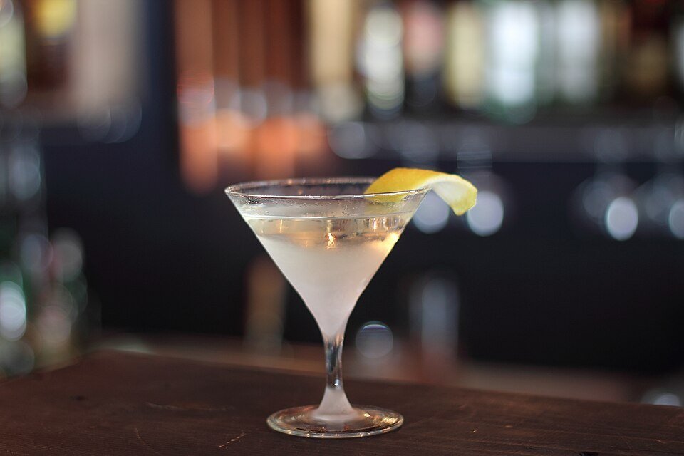 A variety of Christmas martinis in different colours on a bar