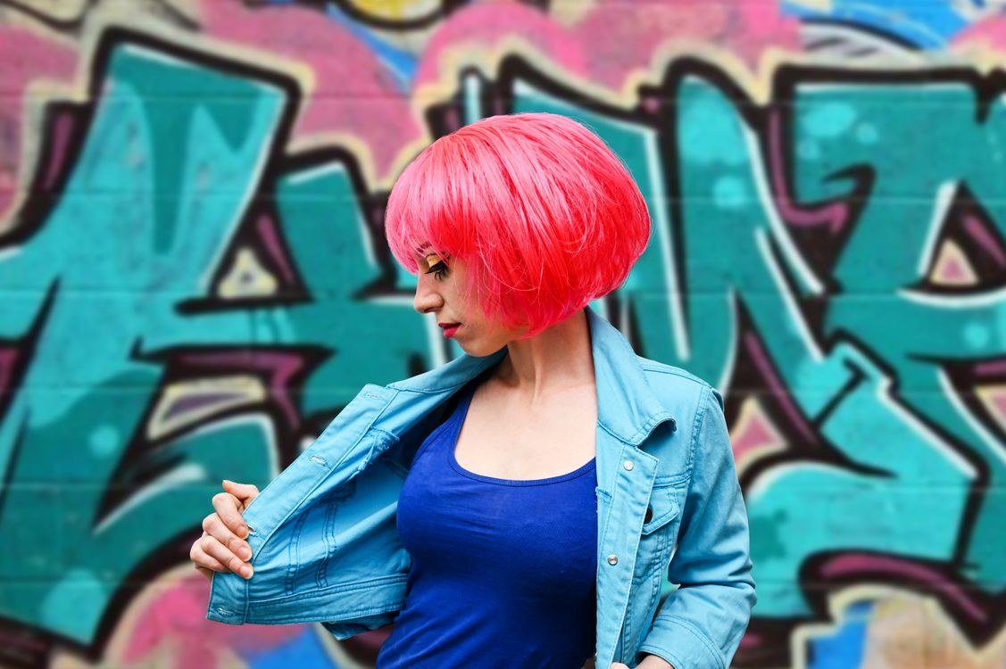 Pink wig styled for cosplay with dramatic volume