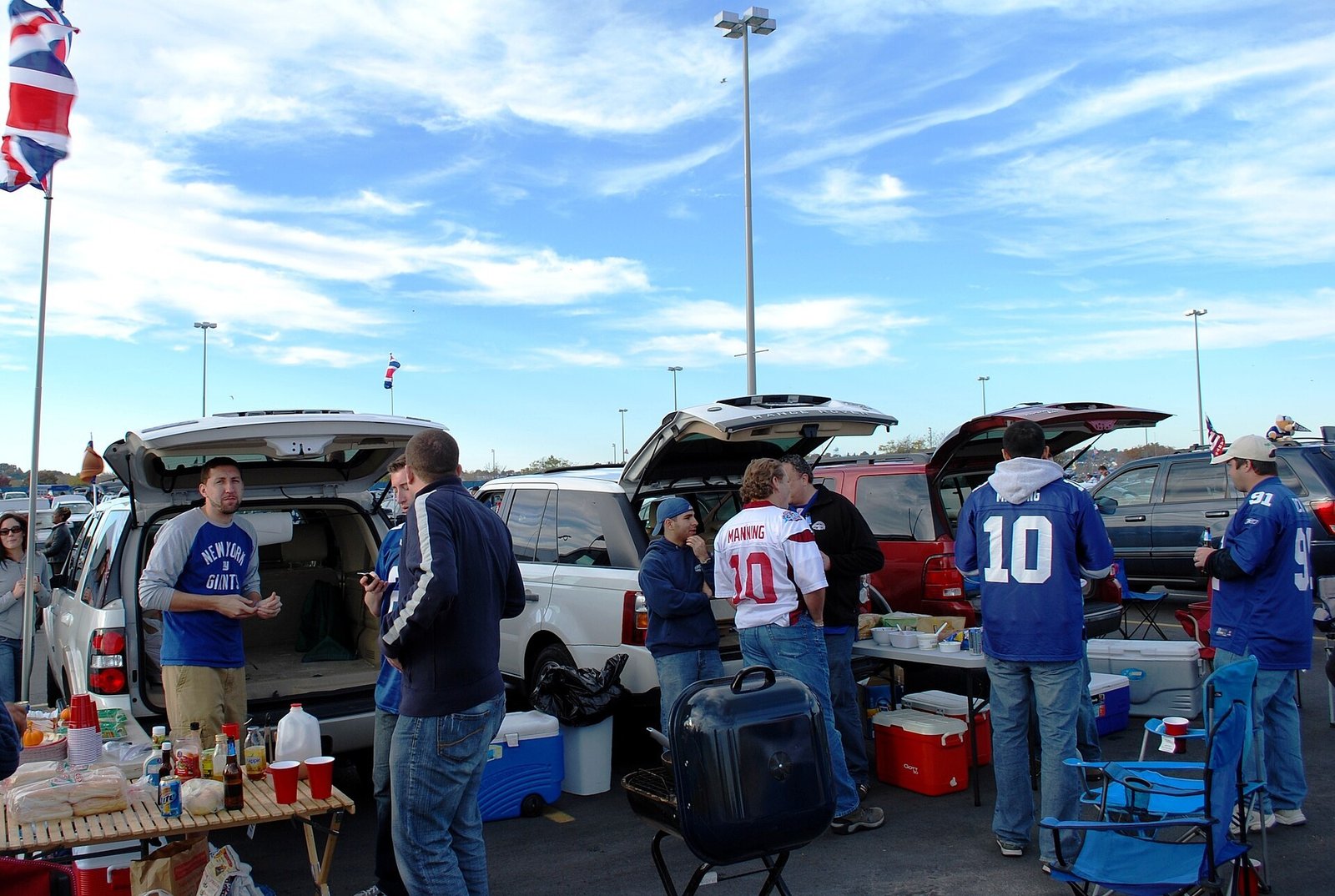 Football fans tailgating in autumn with colourful fall foliage