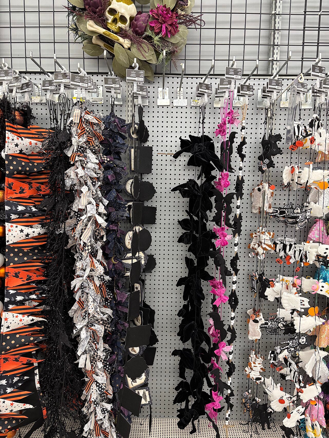 Halloween garland and craft supplies on a store shelf