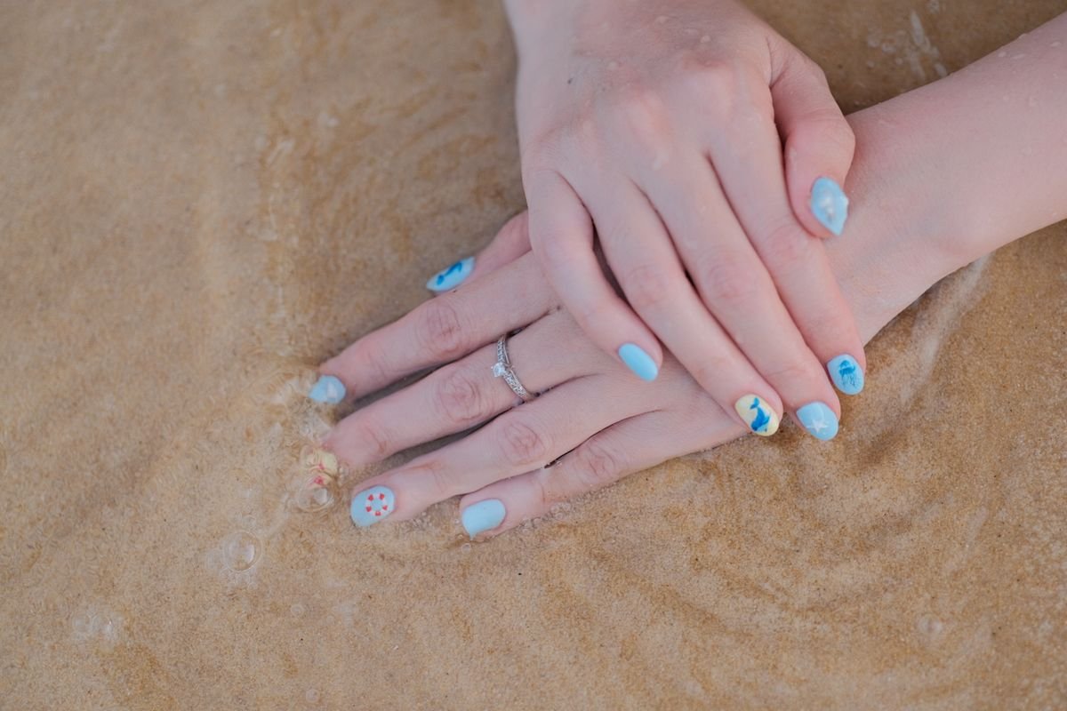 A collection of Hanukkah nail design inspirations on a board