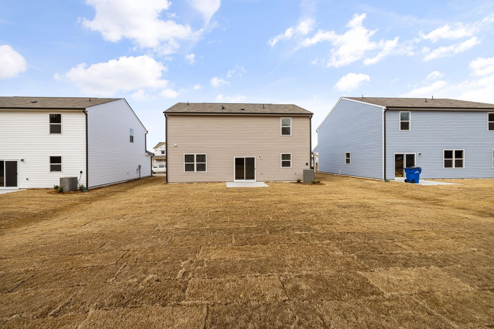 A spacious garden yard prepared for an evening bonfire party