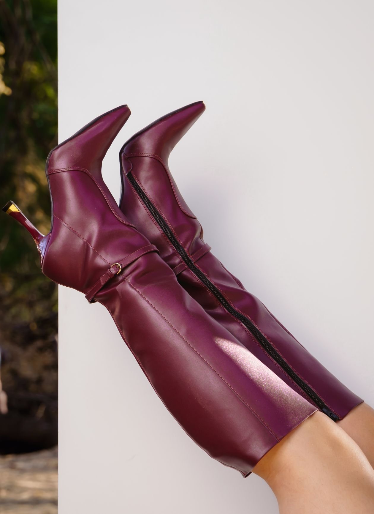 burgundy knee high boots with knit midi skirt