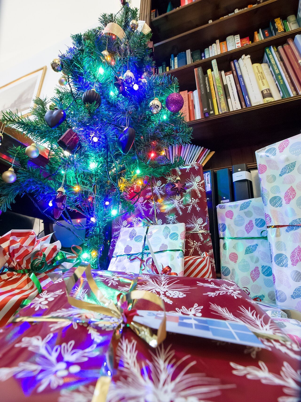 Christmas presents under a decorated tree