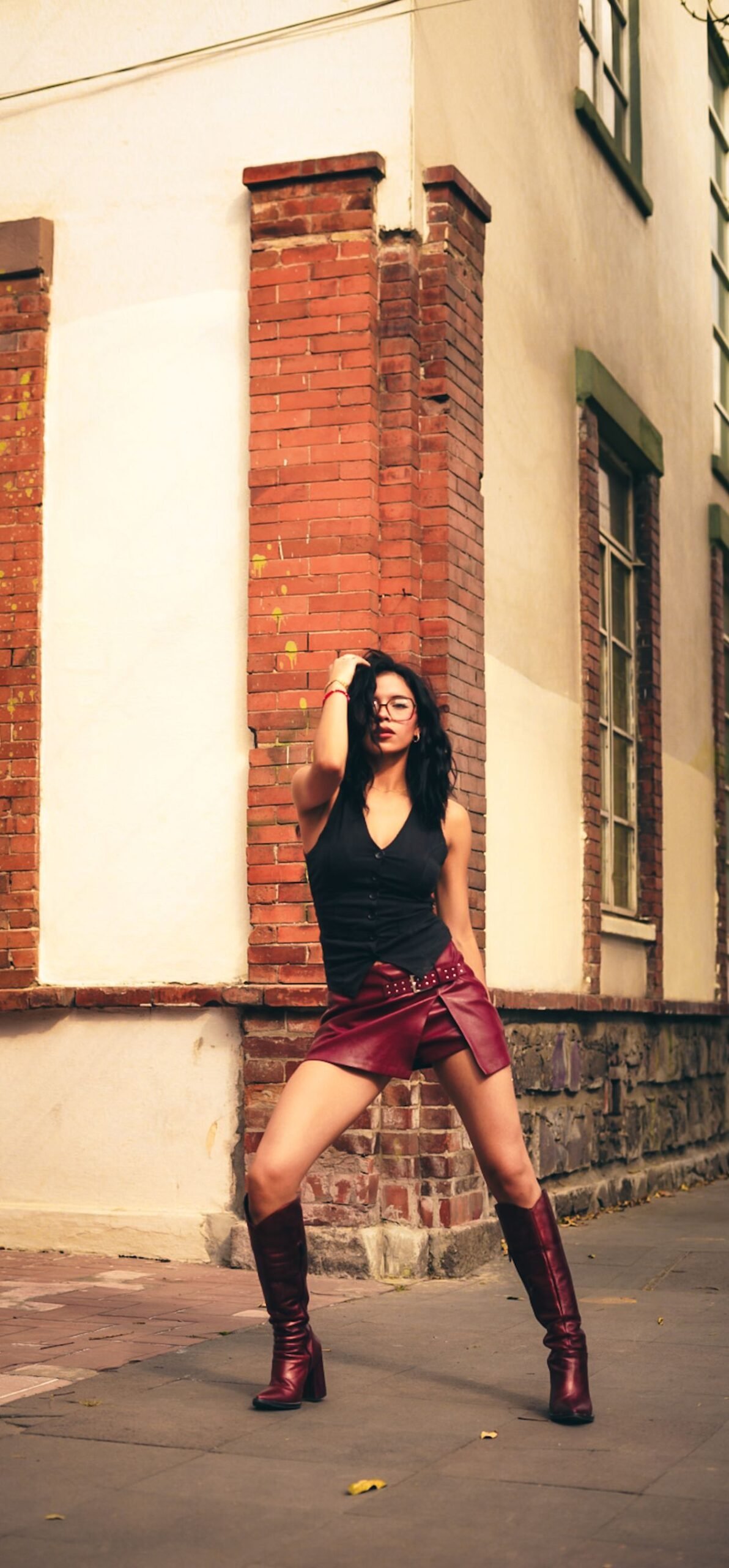 burgundy knee high boots with turtleneck and dark jeans