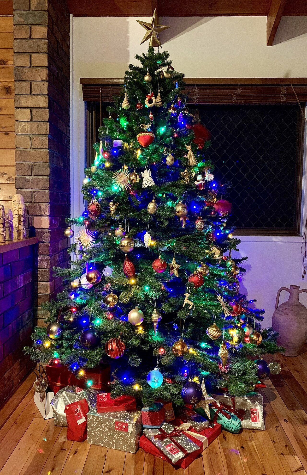 Christmas tree with presents on Christmas Eve night