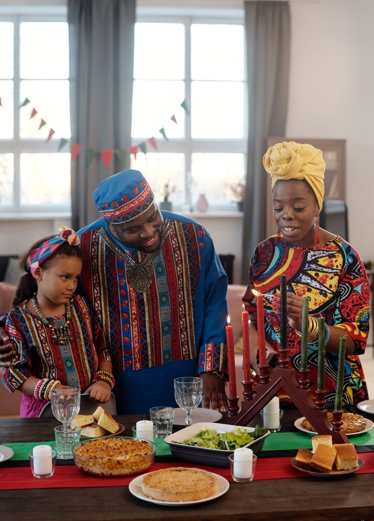 Kwanzaa porch decorated with lanterns and evergreen planters