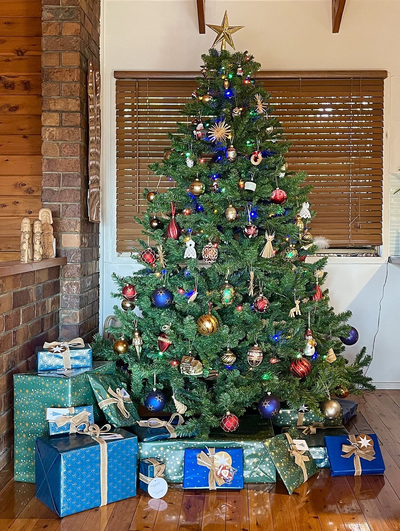 Christmas presents under a tree in a home